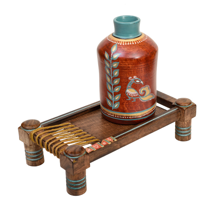 Rustic Red Madhubani Vase placed on Ethnic Charpai Stand (12.5x7x12.5)