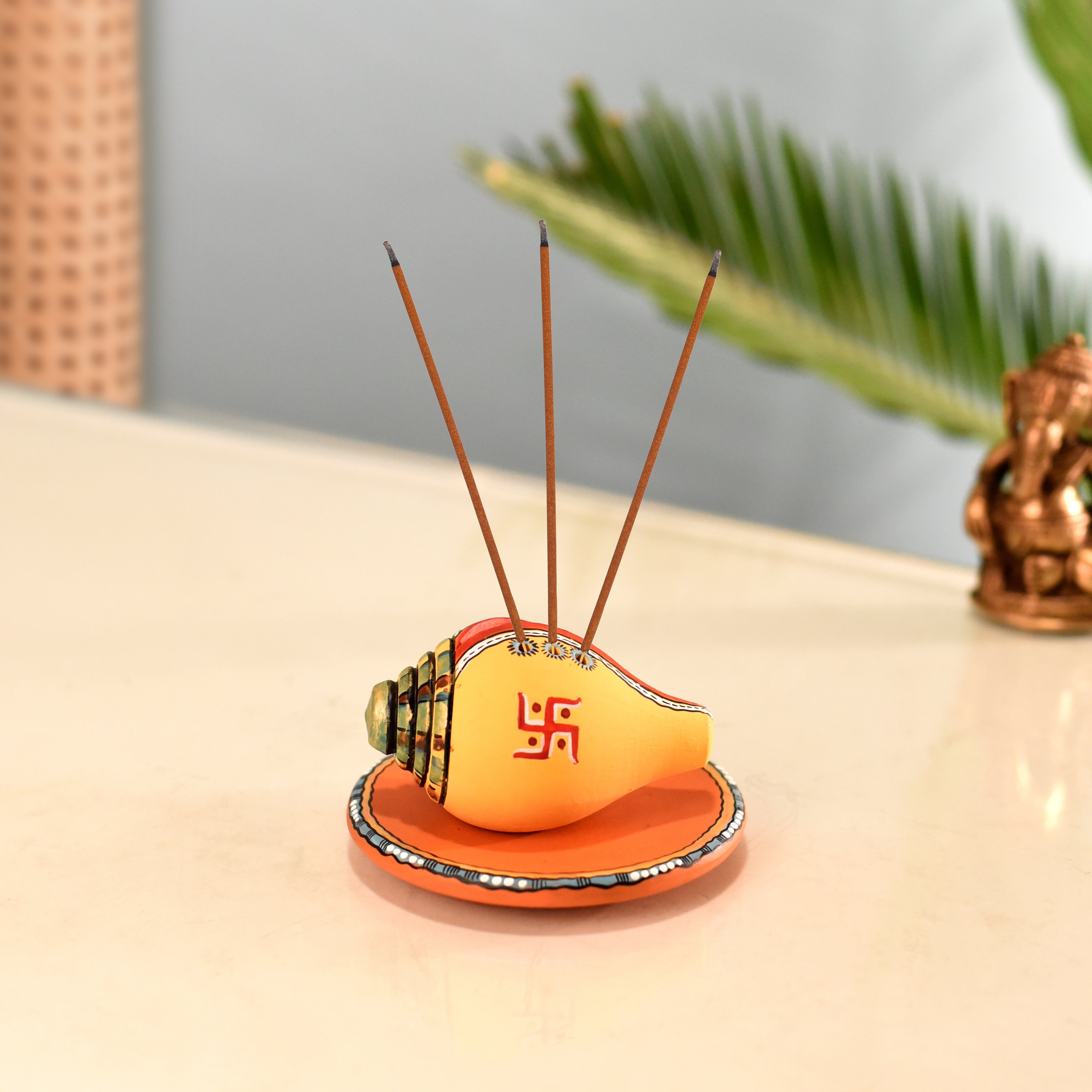 Swastika Divine Conch Incense Holder in Yellow color